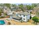House with pool, screened porch, and surrounding landscape in an aerial view at 103 Sandtrap Rdg, Peachtree City, GA 30269