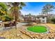 Home with putting green, pool, patio, and mature landscaping at 103 Sandtrap Rdg, Peachtree City, GA 30269