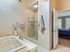 Bathroom with soaking tub, walk-in shower, and access to bedroom at 103 Sandtrap Rdg, Peachtree City, GA 30269