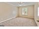 Bright bedroom with neutral walls and carpet flooring at 103 Sandtrap Rdg, Peachtree City, GA 30269