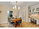 Charming breakfast area with wooden table and built-in cabinets at 103 Sandtrap Rdg, Peachtree City, GA 30269