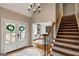 Entryway with double doors, chandelier, and view of a sitting area at 103 Sandtrap Rdg, Peachtree City, GA 30269