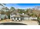 Two-story house with a gray roof, white exterior, and a two-car garage at 103 Sandtrap Rdg, Peachtree City, GA 30269