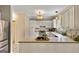 Kitchen with white cabinets, stainless steel appliances, and tile backsplash at 103 Sandtrap Rdg, Peachtree City, GA 30269
