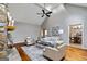 Living room with vaulted ceiling, hardwood floors, and view of the kitchen at 103 Sandtrap Rdg, Peachtree City, GA 30269