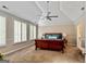 Main bedroom with high ceiling, large windows, and ceiling fan at 103 Sandtrap Rdg, Peachtree City, GA 30269