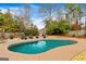 Inviting kidney-shaped pool with surrounding lounge chairs at 103 Sandtrap Rdg, Peachtree City, GA 30269