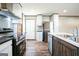 Modern kitchen with stainless steel appliances and wood cabinets at 1979 Cardell Rd # 20, Austell, GA 30168