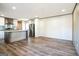 Open living room and kitchen with wood-look flooring at 1979 Cardell Rd # 20, Austell, GA 30168