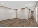 Open living area with wood-look floors and access to hallway at 1979 Cardell Rd # 20, Austell, GA 30168
