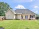 Spacious backyard featuring a well-maintained lawn, wooden deck, and full fence, perfect for outdoor enjoyment at 2110 Kellington Dr, Mcdonough, GA 30253