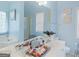 Bathroom with large mirror, white cabinets and blue walls at 2110 Kellington Dr, Mcdonough, GA 30253
