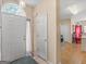 Inviting foyer with bright light, white door, tile flooring, and neutral walls at 2110 Kellington Dr, Mcdonough, GA 30253