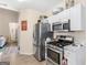 Efficient kitchen featuring stainless steel appliances, white cabinetry, and an adjacent dining area, great for everyday meals at 2110 Kellington Dr, Mcdonough, GA 30253