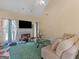 Bright living room with fireplace, vaulted ceiling, and large windows, offering a cozy and well-lit space at 2110 Kellington Dr, Mcdonough, GA 30253