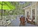 Spacious back deck with outdoor seating, wooded backyard views, and a relaxing atmosphere at 337 Legacy Ln, Peachtree City, GA 30269