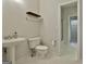 Bathroom featuring tile flooring, a pedestal sink and access to the shower and walk-in closet at 337 Legacy Ln, Peachtree City, GA 30269