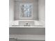 Relaxing soaking tub with tiled surround, bright natural light from window and tile steps to tub at 337 Legacy Ln, Peachtree City, GA 30269