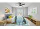 Decorated bedroom with ceiling fan, carpeted floors, and colorful art and decor at 337 Legacy Ln, Peachtree City, GA 30269