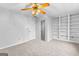 Bedroom features neutral paint, a ceiling fan and a closet at 337 Legacy Ln, Peachtree City, GA 30269
