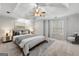Bedroom featuring tray ceilings, carpet, and a window with natural light at 337 Legacy Ln, Peachtree City, GA 30269