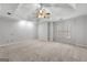 Bright, spacious bedroom boasts a tray ceiling, large window, and neutral carpet at 337 Legacy Ln, Peachtree City, GA 30269