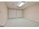 Spacious bedroom with carpet floors, neutral paint, and double door closets for ample storage at 337 Legacy Ln, Peachtree City, GA 30269