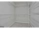 Walk-in closet with wall to wall metal shelving at 337 Legacy Ln, Peachtree City, GA 30269