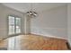 Dining room with hardwood floors, large windows, and decorative lighting at 337 Legacy Ln, Peachtree City, GA 30269