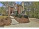 Brick home exterior featuring a manicured lawn and a paved walkway leading to the driveway at 337 Legacy Ln, Peachtree City, GA 30269