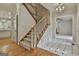 Foyer area showing staircase, hardwood floors in the dining room and white marble tile at 337 Legacy Ln, Peachtree City, GA 30269
