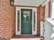 A welcoming front door with glass panes, sidelights, and brick facade creates an inviting entrance at 337 Legacy Ln, Peachtree City, GA 30269