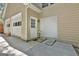 Three-car garage entrance with white doors and a convenient side door entrance at 337 Legacy Ln, Peachtree City, GA 30269