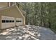 Spacious three-car garage and large driveway provide ample parking and storage space at 337 Legacy Ln, Peachtree City, GA 30269
