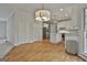 Open kitchen with white cabinets, stainless appliances and wood floors at 337 Legacy Ln, Peachtree City, GA 30269