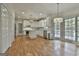 Bright kitchen with white cabinets, stainless steel appliances, and wood floors at 337 Legacy Ln, Peachtree City, GA 30269