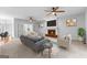 Bright living room with a fireplace, ceiling fans, and modern decor at 337 Legacy Ln, Peachtree City, GA 30269