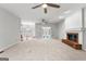 Spacious living room featuring a fireplace and large windows for natural light at 337 Legacy Ln, Peachtree City, GA 30269