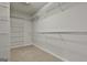 Spacious walk-in closet with carpeted floors, wire shelving and ample storage for an organized wardrobe at 337 Legacy Ln, Peachtree City, GA 30269