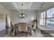 Elegant dining room with coffered ceilings, chandelier lighting, and large windows at 4610 Point Rock Dr, Buford, GA 30519