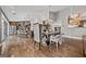 Elegant dining room with chandelier and view of the modern kitchen island at 10195 Kinross Rd, Roswell, GA 30076