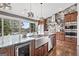 Spacious kitchen island with granite countertops, stainless steel appliances, and breakfast bar at 10195 Kinross Rd, Roswell, GA 30076