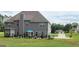 Beautiful backyard with a stone patio and lovely landscaping, perfect for outdoor entertaining and relaxation at 128 Lavender Way # 75, Mcdonough, GA 30252