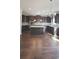 Spacious kitchen with dark cabinets, granite countertops, and a center island at 128 Lavender Way # 75, Mcdonough, GA 30252