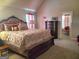 Comfortable main bedroom with a vaulted ceiling and carpet floors at 128 Lavender Way # 75, Mcdonough, GA 30252