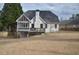 Inviting backyard with deck, screened-in porch, and lush greenery, providing ample space for outdoor enjoyment at 205 Belvedere Green, Peachtree City, GA 30269