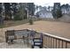 Spacious backyard with a wooden deck, dining set, and sprawling lawn, ideal for outdoor enjoyment at 205 Belvedere Green, Peachtree City, GA 30269