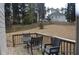 Large backyard with wooden deck, outdoor seating, and fenced perimeter, great for recreation and privacy at 205 Belvedere Green, Peachtree City, GA 30269