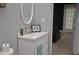 Cozy bathroom featuring a modern vanity, oval mirror, and decorative accents for a welcoming feel at 205 Belvedere Green, Peachtree City, GA 30269