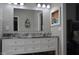 Bathroom featuring a double vanity with granite countertop and ample storage at 205 Belvedere Green, Peachtree City, GA 30269